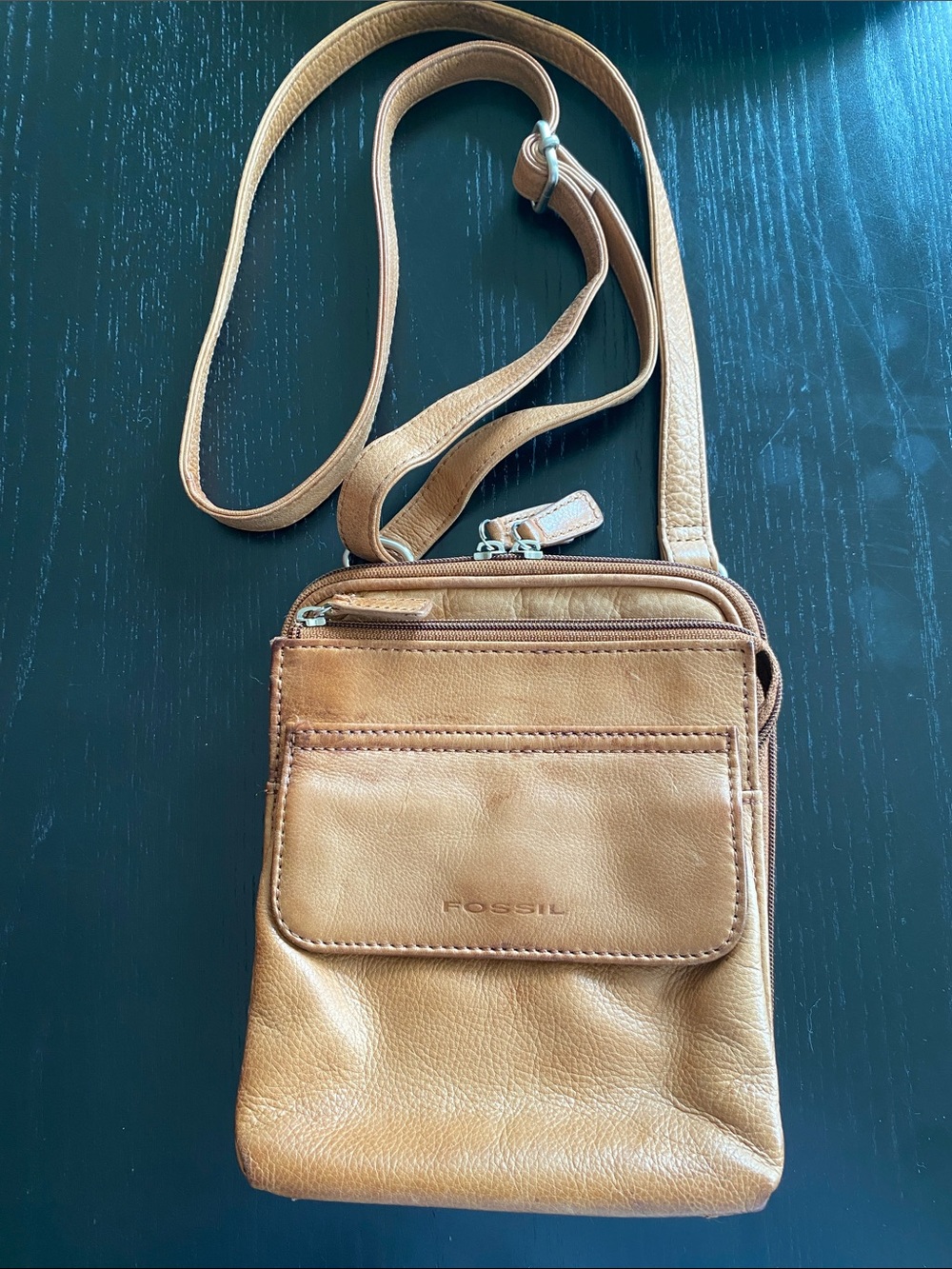 Fossil cognac brown leather messenger bag.